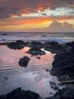 Surf and tide pool in sunset, Kona coast, big island, Hawaii, USA. Art Print